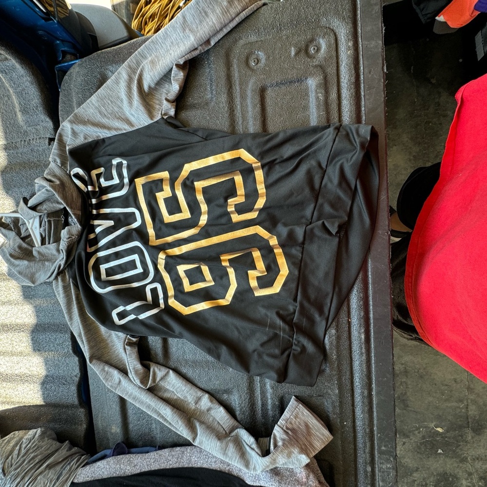 Black and gold, long sleeve sweat shirt used